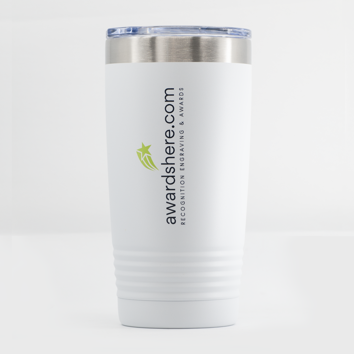 A white insulated travel tumbler with a stainless steel rim and a clear lid, featuring the text 'awardshere.com' and a small green star logo on the front, set against a clean white background.