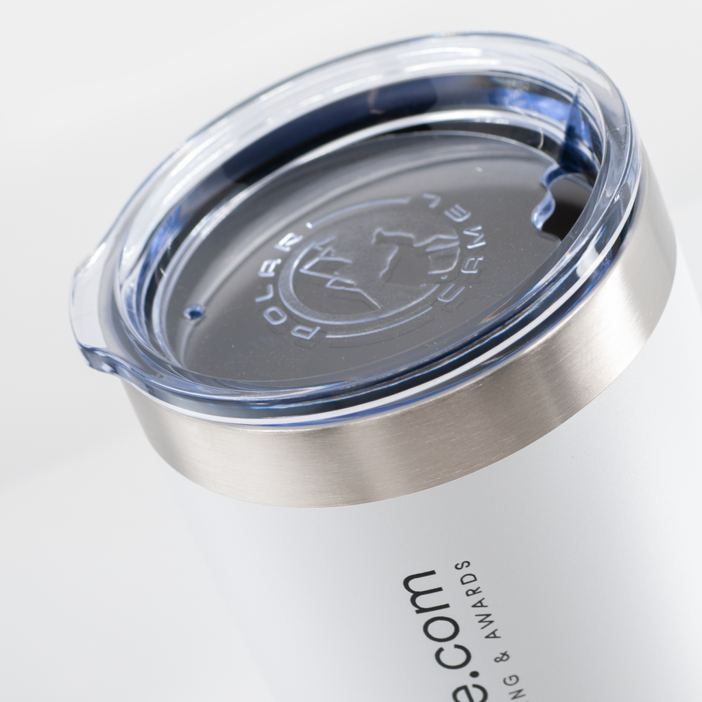 Close-up of a white travel tumbler with a brushed stainless steel rim and a clear lid. The lid has a dark gray center with an embossed map outline and the words 'POLAR CAMEL'.