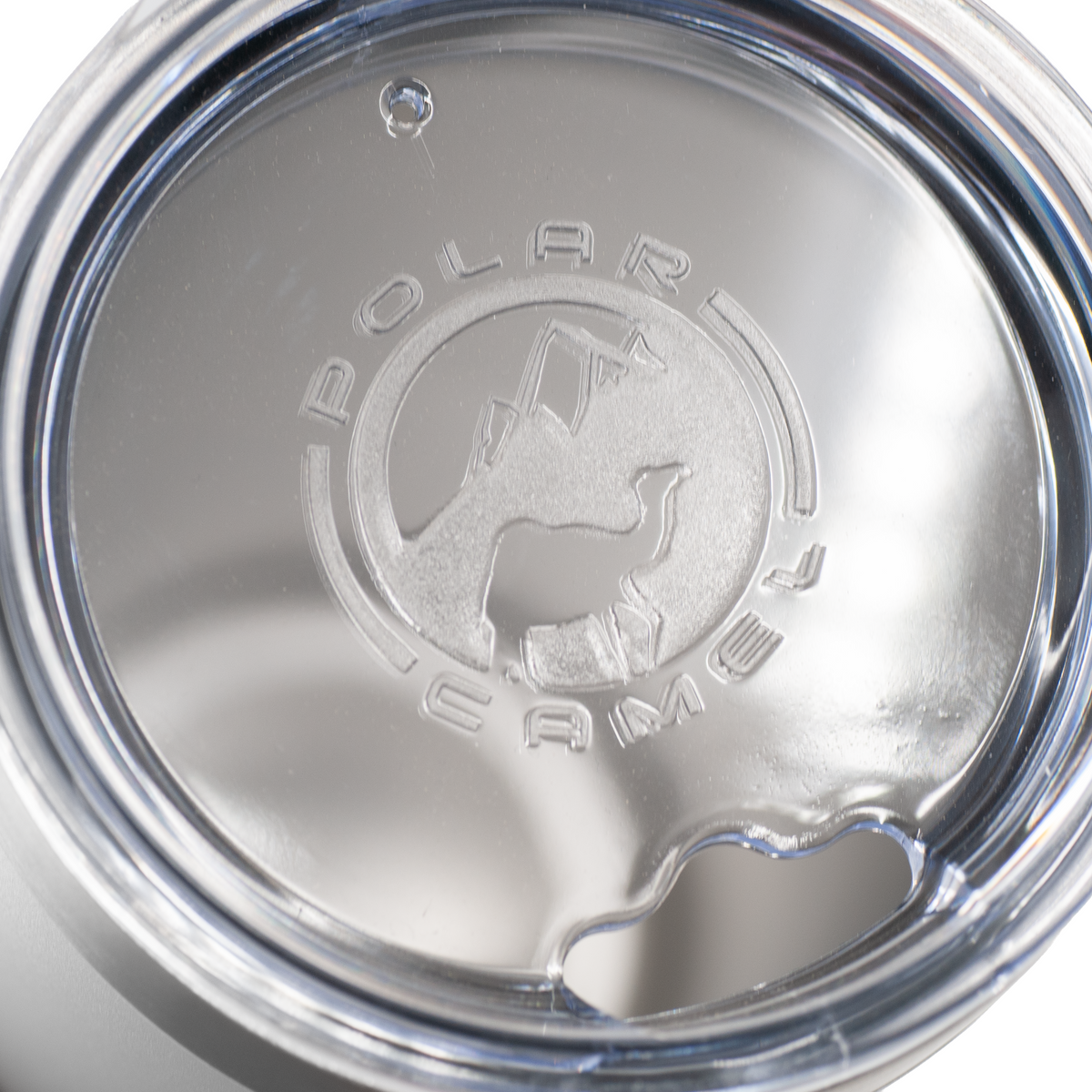 A clear tumbler lid reading Polar Camel with a logo.